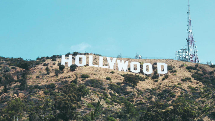 White Hollywood sign on top of the hills